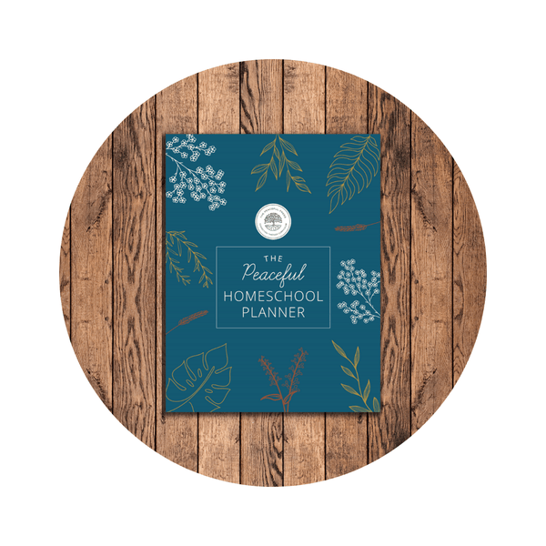 Cover of 'The Peaceful Press Homeschool Planner' featuring a teal background with floral designs and text.